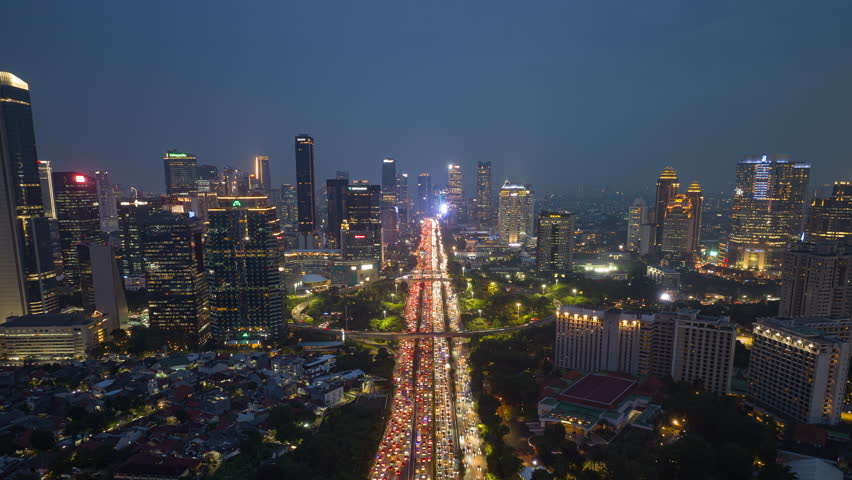 night illumination downtown district jakarta city traffic street road aerial panorama 4k timelapse indonesia Royalty-Free Stock Footage #1107621427
