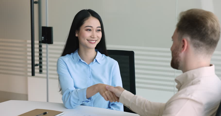 Two business partners make deal, finish formal meeting with shake hands, express respect for cooperation, client feels grateful for good quality services getting, handshake to sales manager in office | Shutterstock HD Video #1107623855