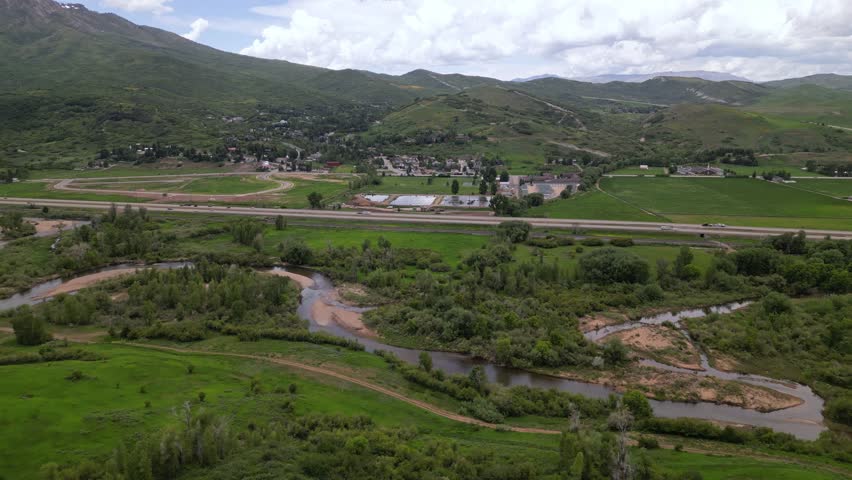 highway road and mountains in Montana aerial view