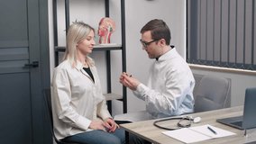 Front view of a female patient being fitted with a hearing aid by a doctor. Health care concept - Powered by Shutterstock - Get 15% off with code: PIKWIZARD15