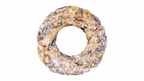 Puff pastry bagel donut with nuts, rotating on white background, turning, looped video

