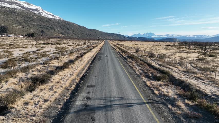 Patagonia Road At Puerto Natales In Magallanes Region Chile. Snowy Mountains. Road Trip Scenery. Magallanes Region Chile. Winter Travel. Patagonia Road At Puerto Natales In Magallanes Region Chile. Royalty-Free Stock Footage #1107646863