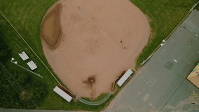 Aerial view of a baseball field with players. Male and female baseball players in action during a game in a baseball stadium. Baseball field with players in uniform playing the game. - Powered by Shutterstock - Get 15% off with code: PIKWIZARD15