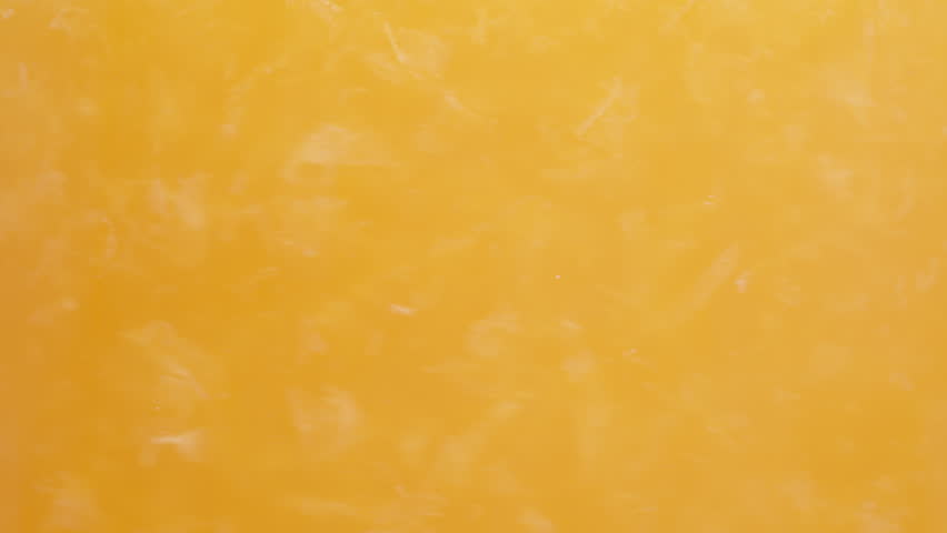 Orange juice with pulp, macro textures in a glass. Royalty-Free Stock Footage #1107648035
