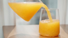 I pour orange juice with pulp from the pitcher and then place it back. - Powered by Shutterstock - Get 15% off with code: PIKWIZARD15