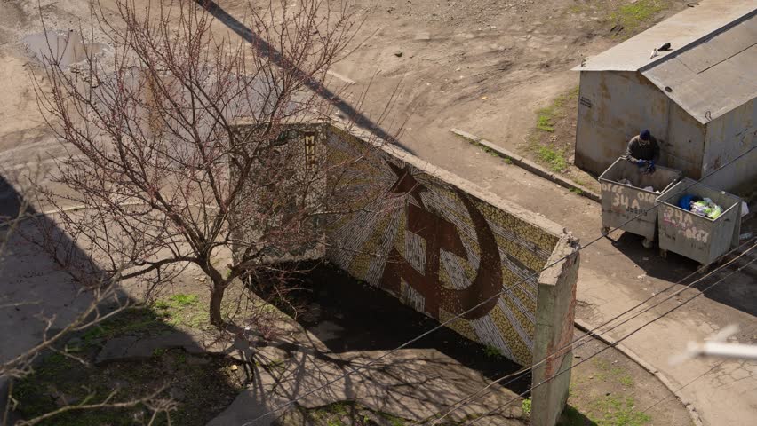 Timelapse video. The old ruined wall of the Soviet era. Hammer and sickle symbol. Royalty-Free Stock Footage #1107650411