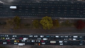 Aerial view. Traffic jam in a big city. Rush hour. Kiev, Ukraine. Car traffic jam. Aerial Drone Flight top down View of freeway busy city. Aerial vertical, vertical video background. 