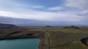 DRONE AERIAL FOOTAGE: Graenavatn is a small lake on the Reykjanes Peninsula, Iceland, known for its vivid coloration. The lake is a volcanic crater that got its name from its unusual green color.
