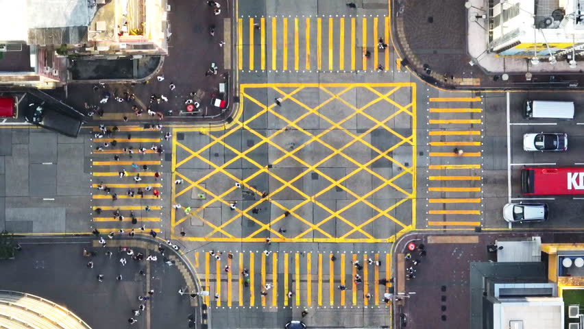 Car traffic transport on road, pedestrian people walk cross zebra crossing, crossroad junction in Mong Kok, Hong Kong downtown. Drone aerial top view. Asian lifestyle, Asia transportation city life Royalty-Free Stock Footage #1107657233