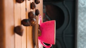 Pink coffee mug and chestnuts on wooden table in front of fireplace - Powered by Shutterstock - Get 15% off with code: PIKWIZARD15