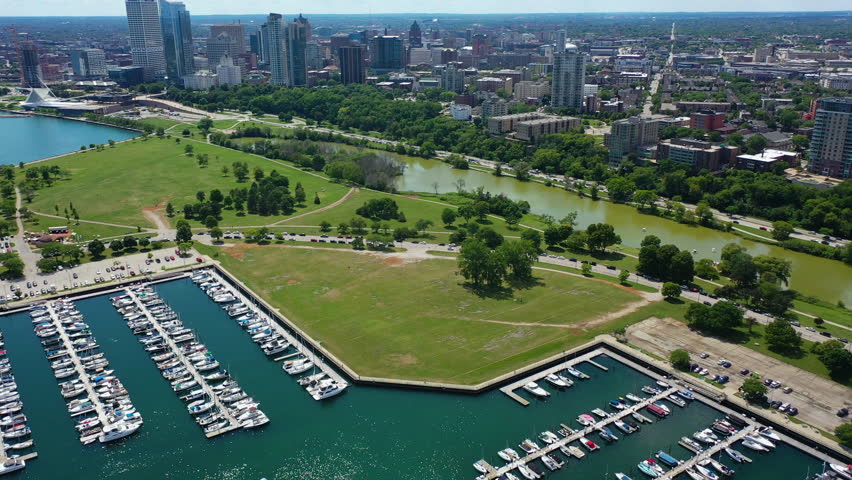 Aerial view backwards over the McKinley Marina in sunny Milwaukee city, WI, USA