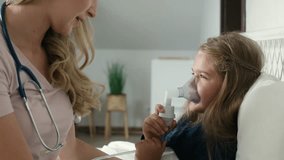 Pediatrician giving nebulizer to an ill child at home. Shot with RED helium camera in 8K.