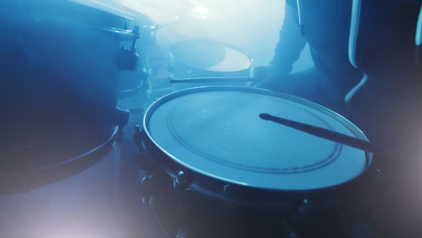 Professional Drummer Playing Drums, Closeup View with Neon Lighting Atmosphere. Royalty-Free Stock Footage #1107667785
