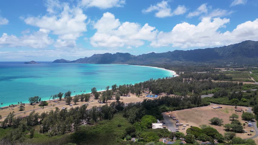 Waimanalo beach to Mokolua Islets, Oahu, Hawaii. Aerial Pan. 4K30.