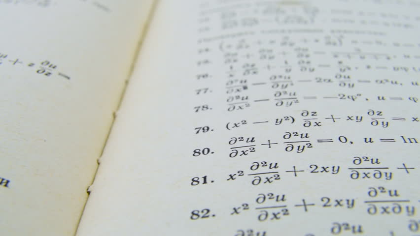 Old paper mathematic formulas formulae equations on paper integral math practice expression. Mathematical equations tasks formulas printed on old paper camera slide. Studying.