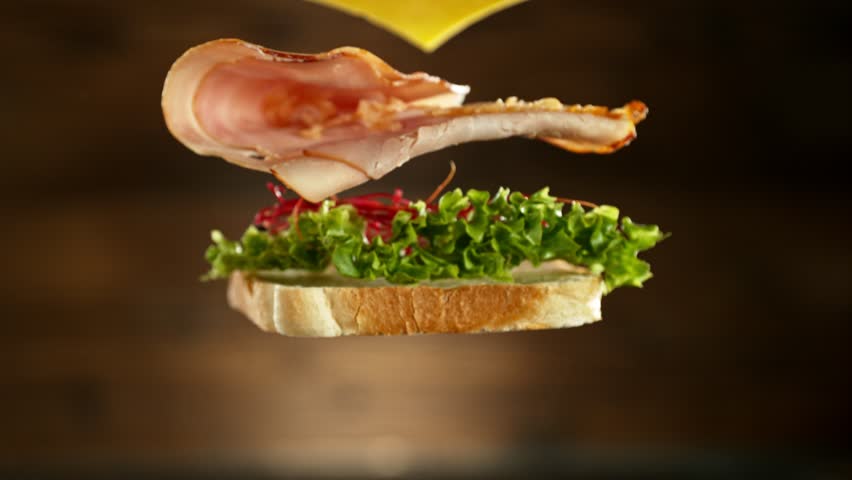 Super slow motion of stacking sandwich pieces. Camera in motion. Filmed on high speed cinema camera, 1000 fps. Placed on high speed cine bot. Speed ramp effect. Royalty-Free Stock Footage #1107691385
