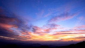 Breathtaking beauty of a 4K video timelapse capturing the mesmerizing sunset over the majestic mountain. Phu Soi Dao National Park, Thailand