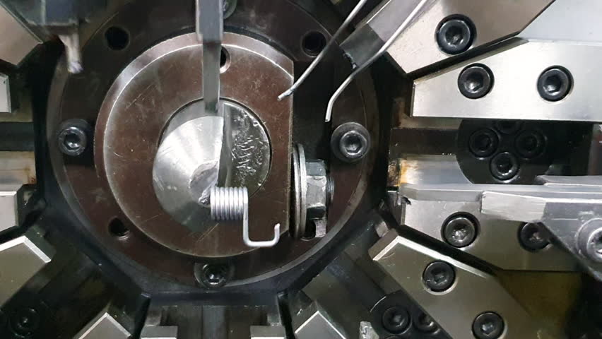 Close up scene the spring coiling machine operation.The mechanical parts manufacturing  - Powered by Shutterstock - Get 15% off with code: PIKWIZARD15