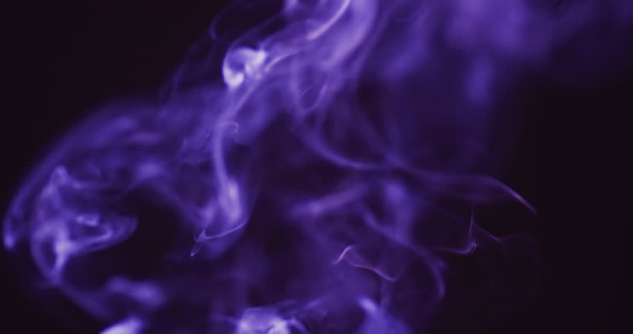 Video of purple clouds of smoke moving with copy space on black background. Halloween, spooky background and movement concept digitally generated video. Royalty-Free Stock Footage #1107707401