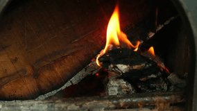 Pink coffee mug and chestnuts on wooden table in front of fireplace - Powered by Shutterstock - Get 15% off with code: PIKWIZARD15
