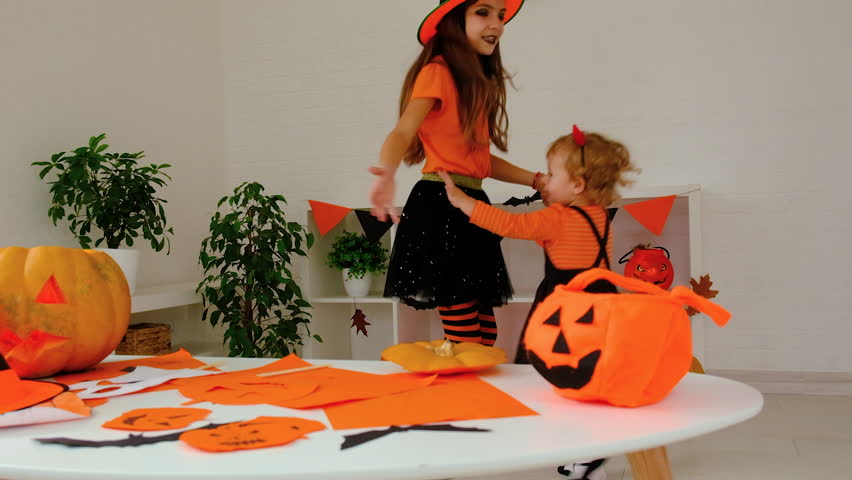 Halloween holiday child and pumpkin. Selective focus.