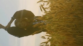 Vertical video romantic blonde caucasian woman on a wheat field