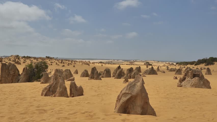 The Pinnacles Desert, Western Australia. Pinnacle in Nambung National Park. Natural wonder of big stones spread around in a desert. Thousands of limestone pillars in the Pinnacles Desert. 