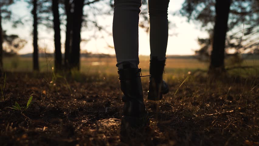 Autumn forest nature in park. Woman girl travels. Active trekking freedom of travel. Hiking in the forest. Summer long walk. Legs distance walking. Sports walk in open air. legs close-up in the forest Royalty-Free Stock Footage #1107728965