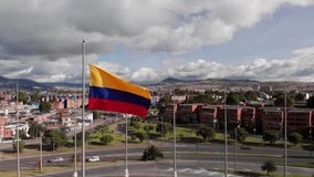 Colombian flag in the background you can see the city of Bogota, with a background road with traffic and horizontal grass, plane - Powered by Shutterstock - Get 15% off with code: PIKWIZARD15