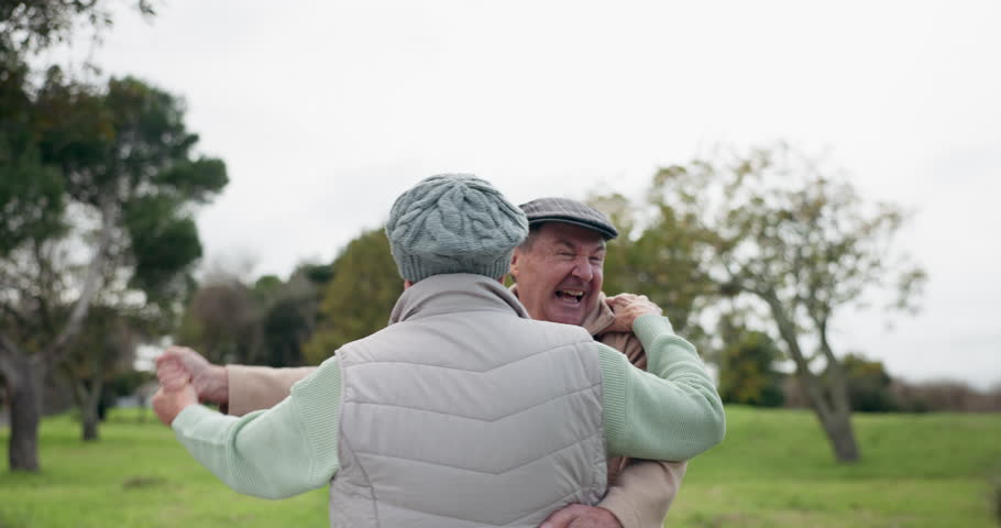 Dancing, senior couple and outdoor at a park with fun energy, happiness and love on holiday. Elderly man and woman in nature for a spin, funny adventure and celebration of retirement and freedom | Shutterstock HD Video #1107737005