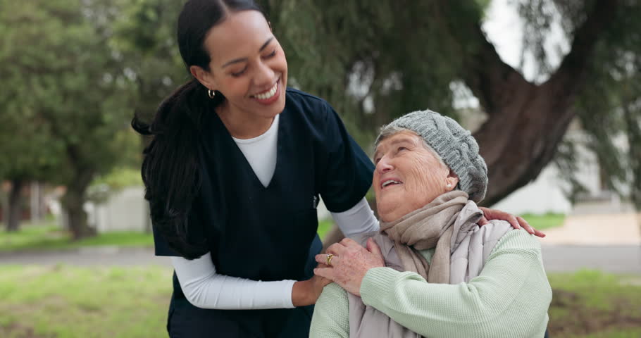 Nurse, park and a senior woman in a wheelchair at the park, laughing together for freedom or a funny joke. Healthcare, medical or assisted living with a carer and patient walking outdoor in a garden Royalty-Free Stock Footage #1107737313
