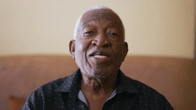 Point-of-View Video Conference of Happy African American Senior Woman Engaging in Conversation with Family Relatives on Webcam - Powered by Shutterstock - Get 15% off with code: PIKWIZARD15