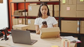 African american woman ecommerce business worker make photo to packages by smartphone at office - Powered by Shutterstock - Get 15% off with code: PIKWIZARD15