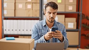 Young hispanic man ecommerce business worker using smartphone celebrating at office - Powered by Shutterstock - Get 15% off with code: PIKWIZARD15