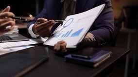 Business people meeting to discuss analyzing financial charts and business market growth graph to plan business strategies and investments. Financial planning and business budget. - Powered by Shutterstock - Get 15% off with code: PIKWIZARD15