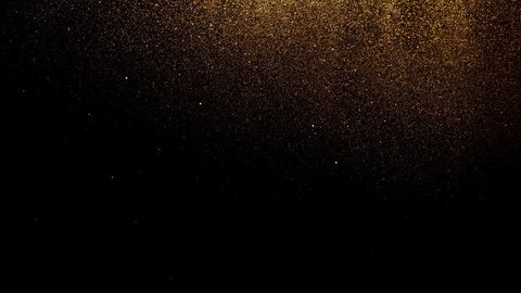 Golden glitter background in slow motion. Beautiful transition with real gold particles flying in wind on black background, shot with depth of field. Gold dust bokeh abstract background Adlı Stok Video