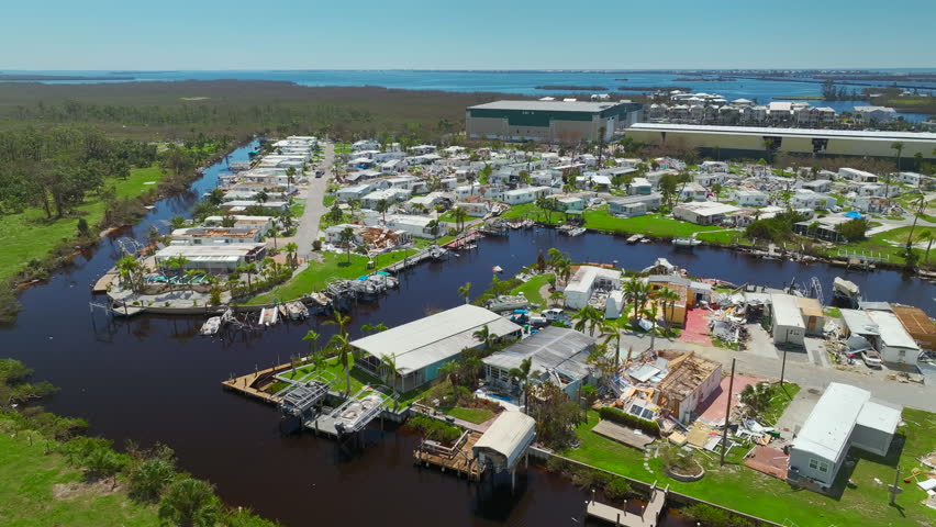 Destroyed by hurricane Ian suburban houses in Florida mobile home residential area. Consequences of natural disaster