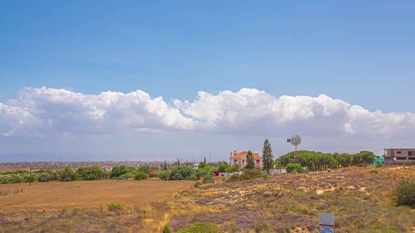 Timelapse of Cumulonimbus Forming Over the Skies of Cyprus Landscape with Blue Mediterranean Skies.