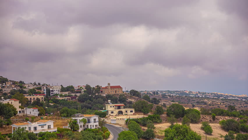 Timelapse of Overcast Clouds Sweeping Across a Small Town on the Island of Cyprus.
