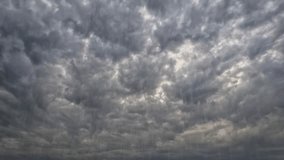 fast timelapse video with heavy rain and big cold gray clouds