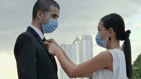 Witness the modern urban landscape come alive in this powerful 4K video. Amidst the city's vibrant energy, a group of office workers don face masks, emblematic of our times.