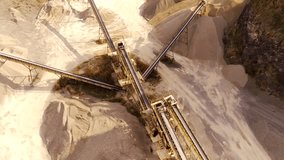 Industrial Extraction and Manufacturing Footage. Aerial video of a gravel pit and conveyor belts for stone distribution. Active mining facility located on Mount Pangradinan. High Quality 4k Video 