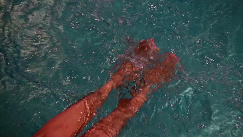 hydroteraphy for woman legs and feet inside swimming pool water Royalty-Free Stock Footage #1107799219