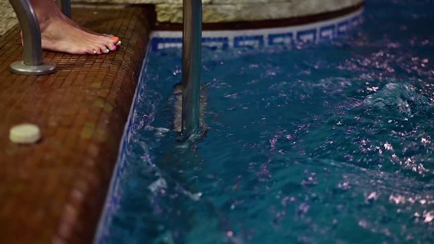 hydroteraphy for woman legs and feet inside swimming pool water Royalty-Free Stock Footage #1107799225