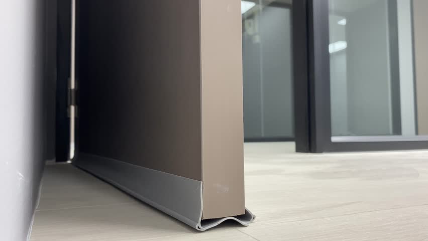 Door stopper for noice reduction low angle view open and close brown door indoor 