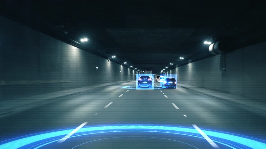 Inside view a moving autonomous self-driving car vith HUD elements driving through a tunnel, scanning the surrounding cars and road with a sensor. Concept of the smart transort of the future. 4k  Royalty-Free Stock Footage #1107809345