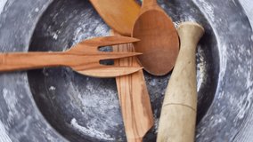 wooden kitchen utensils rotating. Food background. 4k video capture