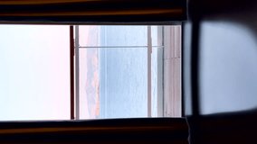 Window view of a sparkling sea. Ship cruise vertical video