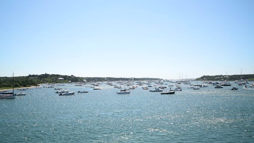 Sailboats, yachts, and other ships in the harbor. Edgartown, Martha