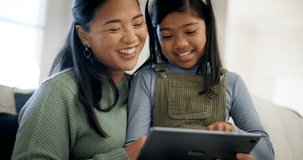 Asian mother, girl and tablet for learning, video or online course for development, care or laugh with meme. Mom, daughter and digital touchscreen for studying, social media app or reading together